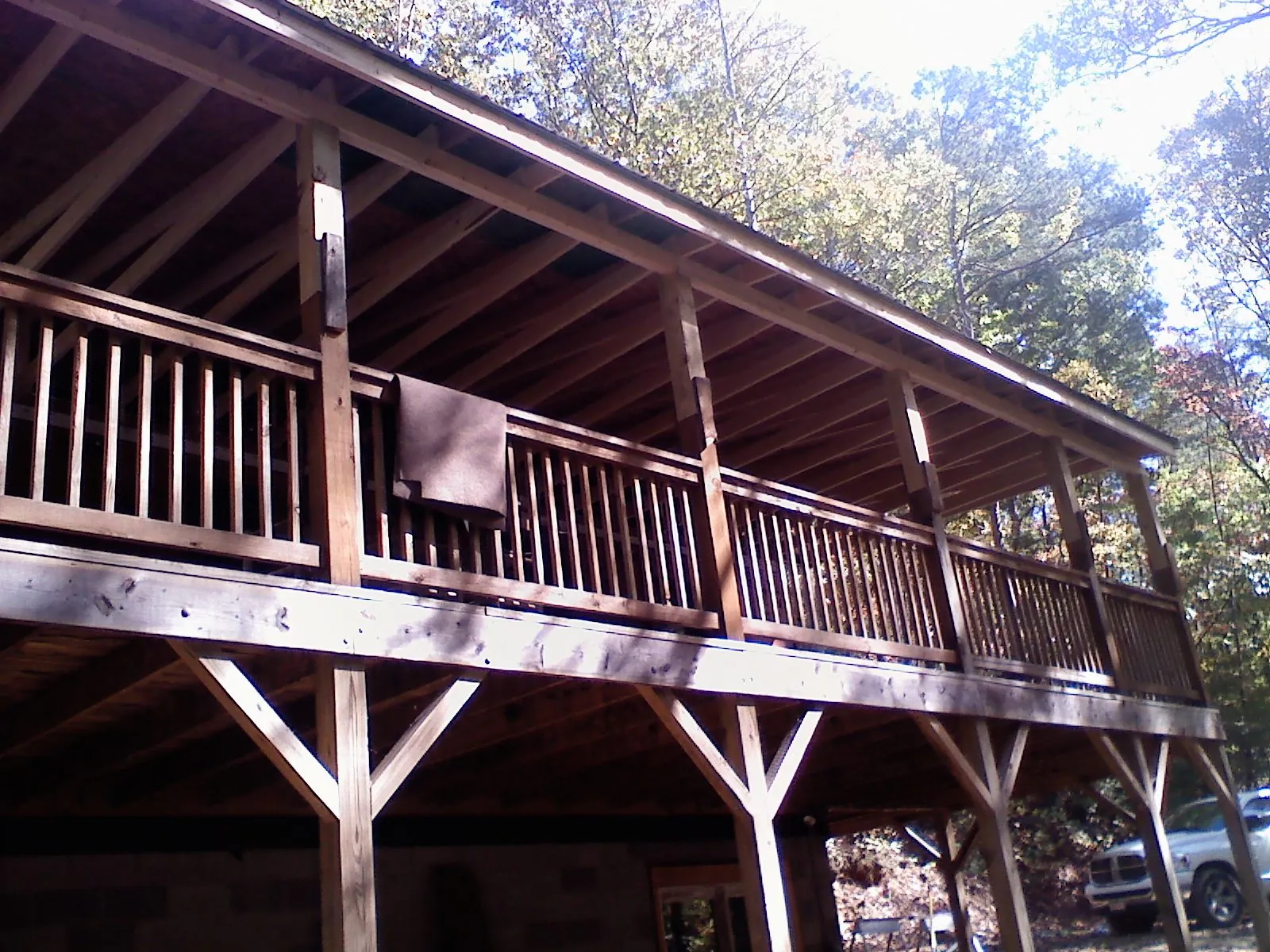 Timber framing under a new elevated porch and deck — Roof Leak Repair in Bondurant by Roofing Brothers